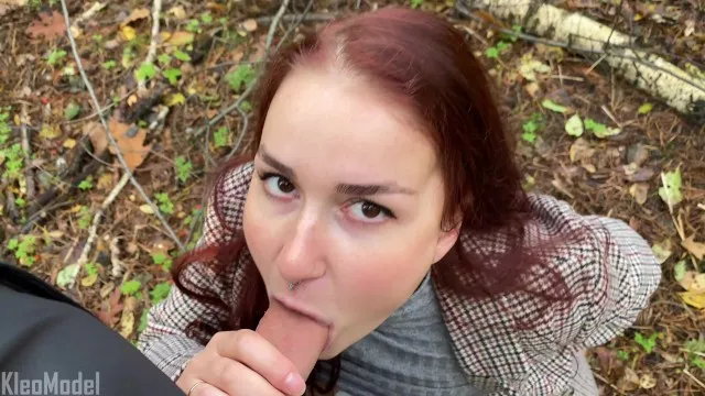 Blowjob in the Park from a Red-haired Girl in a Coat.